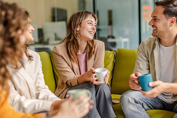 istock Team engages in a collaborative discussion while enjoying coffee in a modern office space 2225373967
