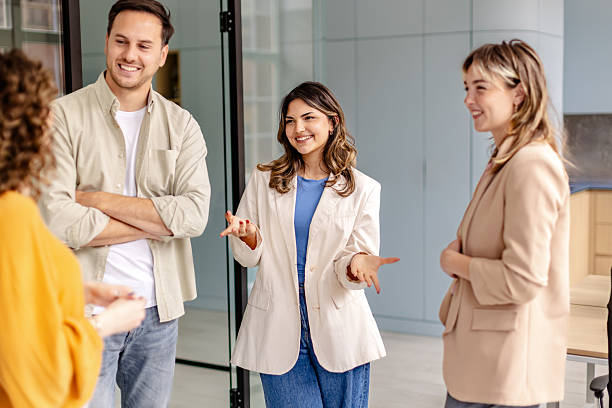 istock Team engages in lively discussion at modern office space during collaborative meeting 2225374118