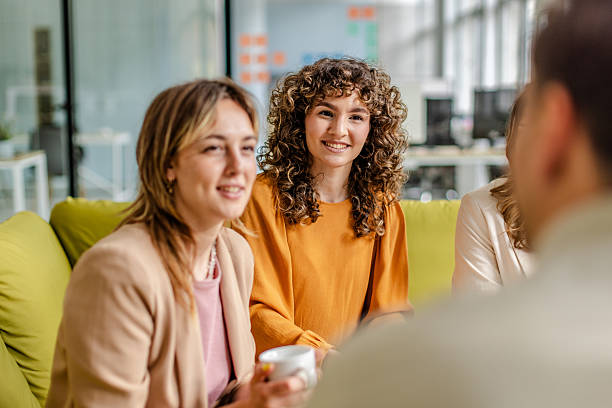istock Team engages in productive discussion at modern office space fostering collaboration and innovation 2225374150