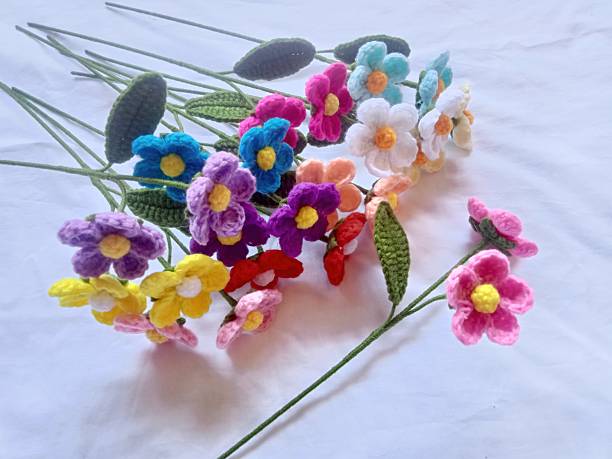 istock Handmade Crochet flowers bouquet for decoration, illustration, background texture 2225374214