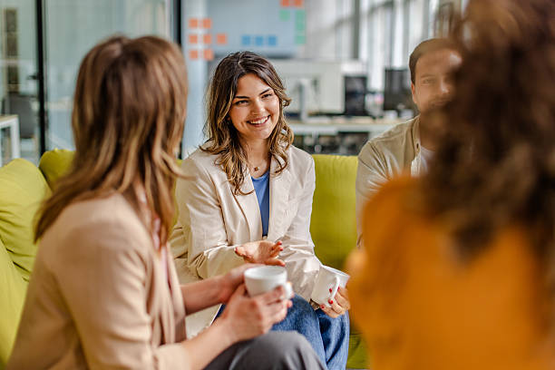 istock Team members collaborate and share ideas during an engaging meeting in a modern office environment 2225374236