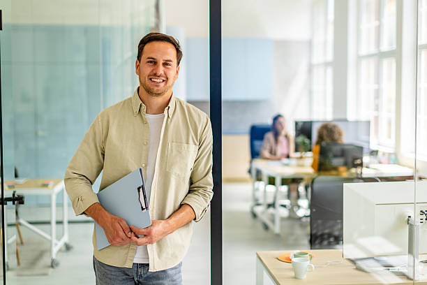 istock Team members collaborate in a modern office setting while a manager prepares for a productive meeting with colleagues 2225374450