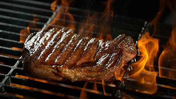 istock Close-up of Beef Steak on a Grill 2225375171