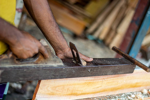 istock A man is holding wood cutter machine and the background is blurred 2225375469