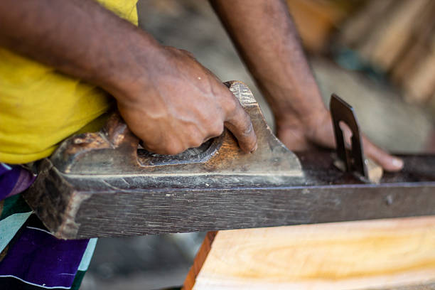 istock A man is holding wood cutter machine and the background is blurred 2225375479