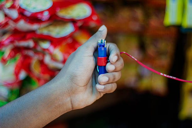 A man is holding Gas light, and the background is blurred