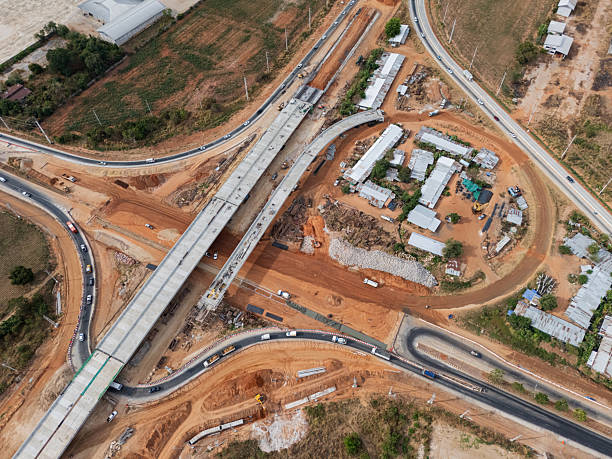 istock The construction site before the construction of the concrete bridge over the intersection by crane workers, tractors, and backhoes 2225375955