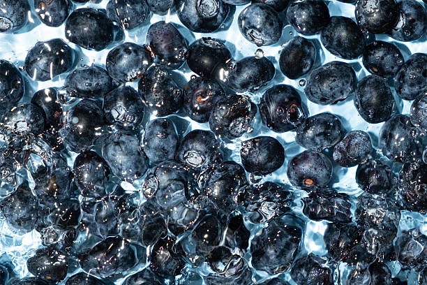 istock Top View of Blueberries Splashing in Water 2225376069
