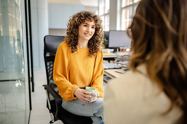 istock Team members discuss ideas during a collaborative meeting in a bright, modern office environment with technology and open workspace 2225376178