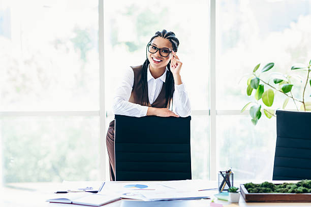 istock Successful businesswoman smiling confidently in a modern office workspace surrounded by contemporary design and natural accents 2225376562