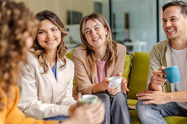 istock Team members engage in a productive meeting while enjoying coffee in a modern office environment 2225376673