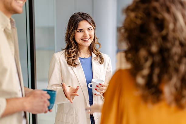 istock Team members engage in productive discussion during a meeting in a modern office environment 2225378484