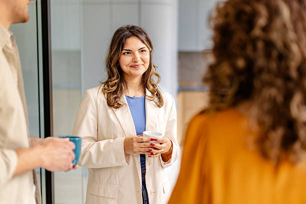 istock Team members engaged in a productive discussion during a meeting in a modern office environment 2225378796