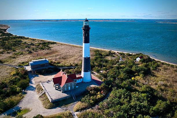 istock Fire Island Lighthouse aerial view with ocean backdrop. 2225380701
