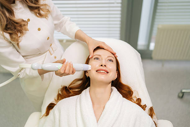 istock Cheerful young woman client having mesotherapy treatment from professional beautician using specialized device, aiming to rejuvenate skin. 2225384196