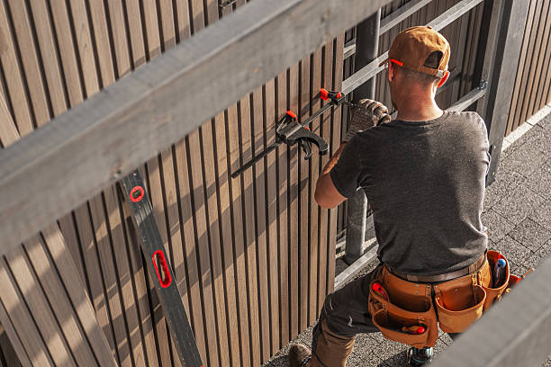 istock Skilled Worker Installing Lamella Wood Paneling in a Modern Construction Project During Daylight Hours 2225384515