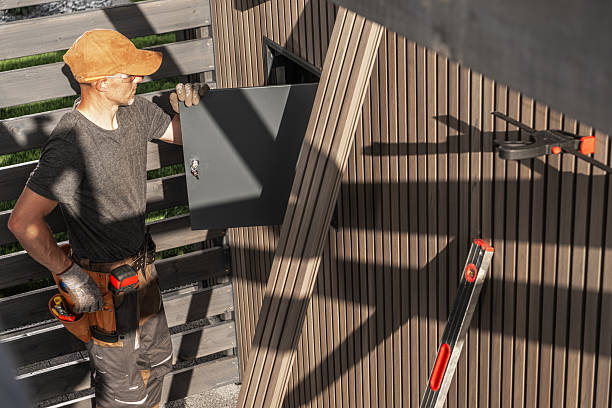 istock Construction Worker Installing Lamella Panel on Modern Building Exterior in Bright Daylight 2225384582