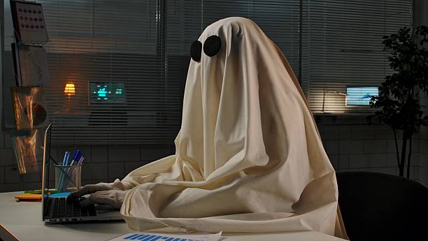 istock Ghost in an Office Working Late Night on a Laptop 2225385870