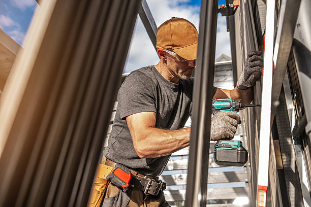 Worker Using Power Tool to Install Lamella Panels During Construction Project in Sunny Outdoor Setting