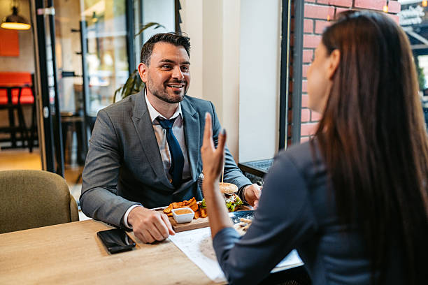 istock Two Business Colleagues Having A Lunch Break In A Restaurant 2225388641