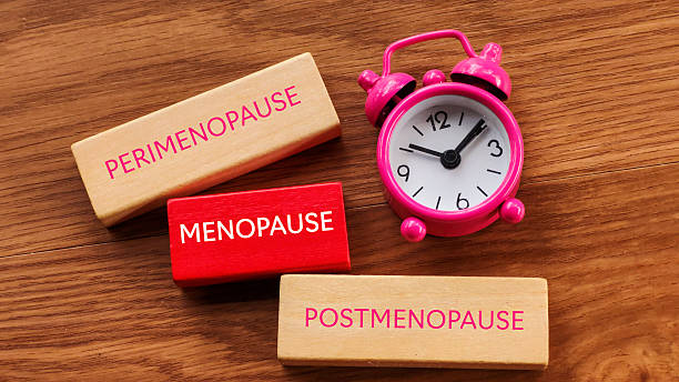 Perimenopause, Menopause, and Postmenopause Timeline with Clock stock photo