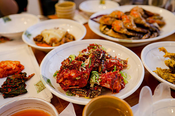 istock Korean Seafood Feast in Yeosu – Spicy Marinated Crabs, Fresh Octopus and Local Drinks 2225391152