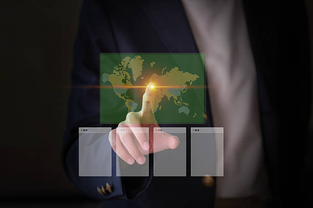istock A woman in a business suit interacts with a virtual network. 2225391189