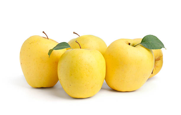 istock Many fresh yellow apples isolated on white 2225401542