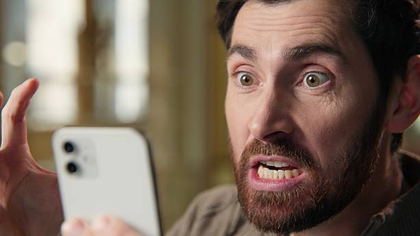 istock Angry stressed annoyed business man scream mobile phone problem irritated Caucasian businessman guy male crazy shout yell emotion mad furious anger smartphone message crash negative in office close up 2225404413
