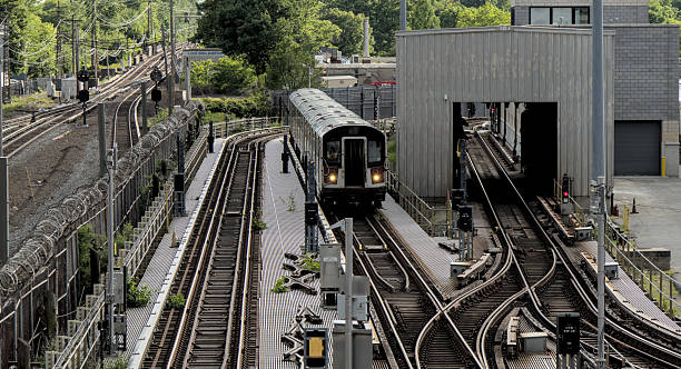 istock 7 train running on above ground elevated tracks in flushing queens new york city (railroad commuter line) 2225404592