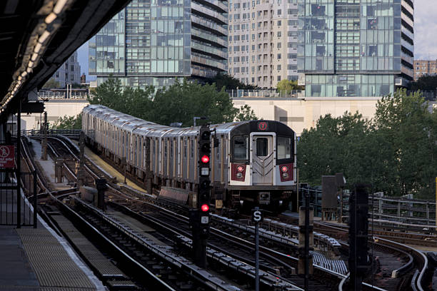istock 7 train running on above ground elevated tracks in flushing queens new york city (railroad commuter line) 2225406554