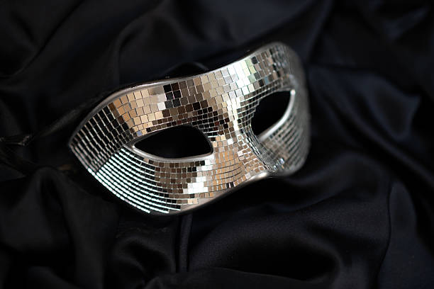 Carnival masquerade mirror man mask, mysterious accessory for a party on black fabric