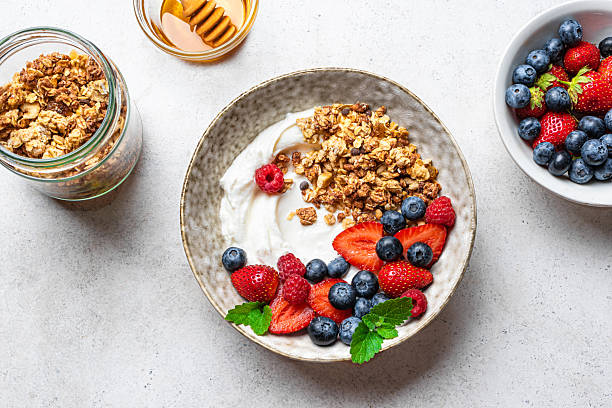 istock Granola bowl with greek yogurt and fresh berries 2225409932