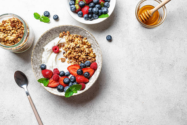 istock Granola bowl with greek yogurt and fresh berries 2225409946