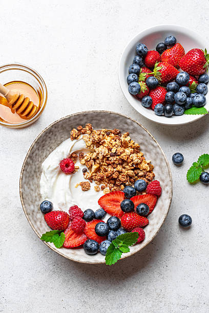 istock Granola bowl with greek yogurt and fresh berries 2225410061