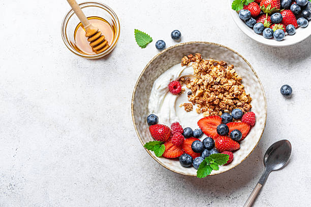 istock Granola bowl with greek yogurt and fresh berries 2225410141