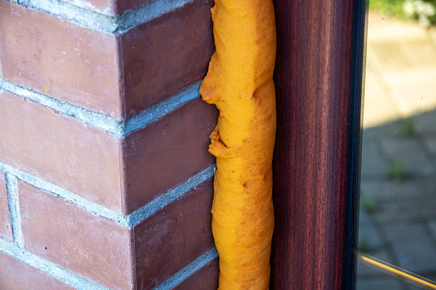 istock A brick wall has a piece of yellow foam attached to it 2225410982