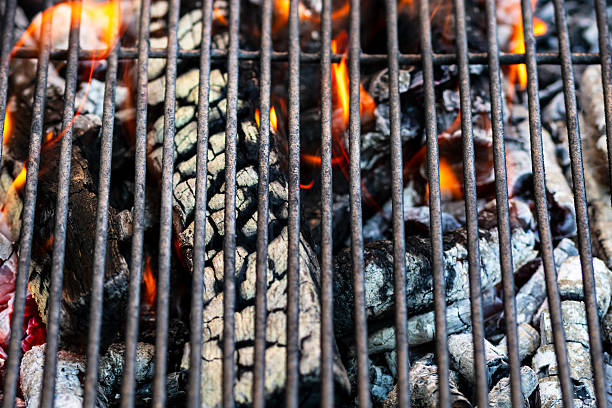 BBQ grill with burning wood and fire flames. Empty hot charcoal barbecue grill with bright flame