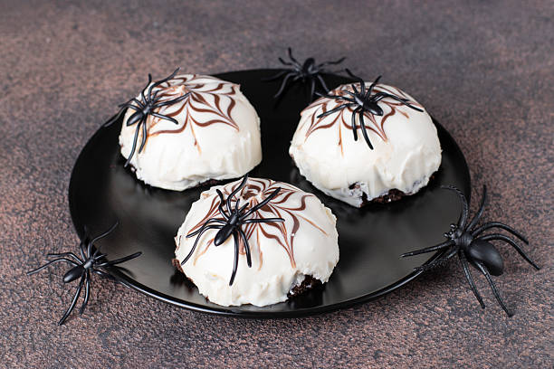 istock Curd cheese cakes with cobwebs - an idea for treat for Halloween 2225425472