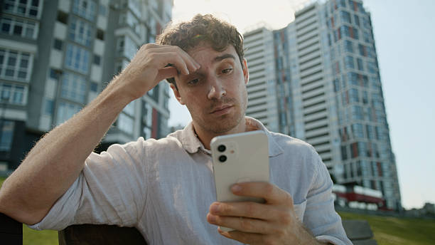 istock Caucasian man mobile phone smartphone error problem broken businessman male business guy disappointed stressed lost failure frustrated bad news cellphone outdoor gadget upset city internet low battery 2225426846