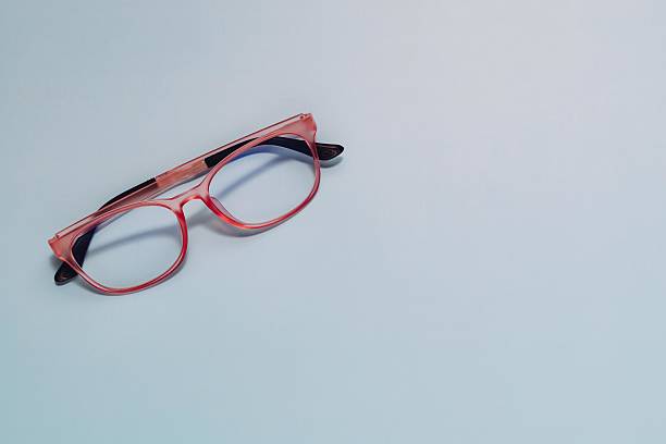 istock Pink Eyeglasses on Light Blue Background, Vision and Style Concept 2225427801