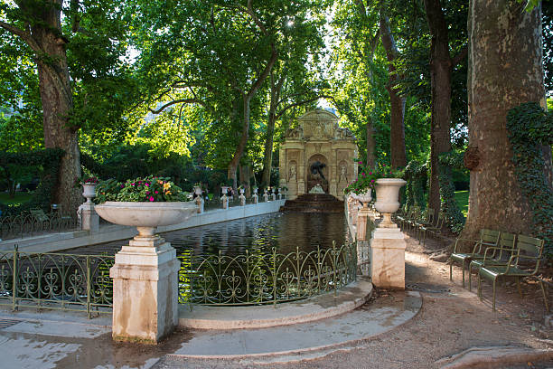 istock Fountain and pool in a public garden 2225440679