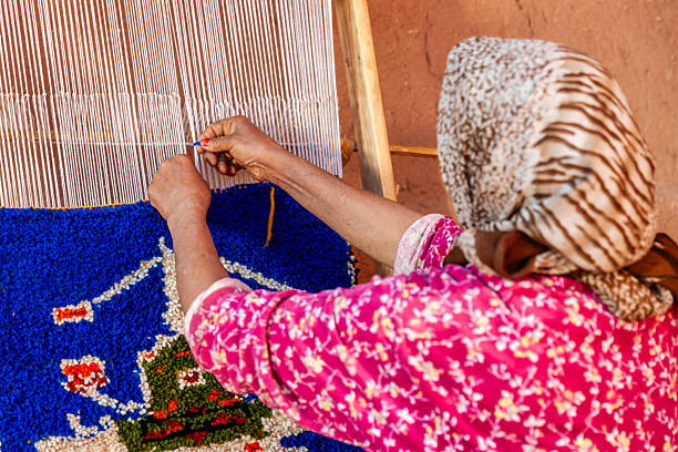 istock Berber woman weaving textiles, Ouarzazate, Morocco 2225442149
