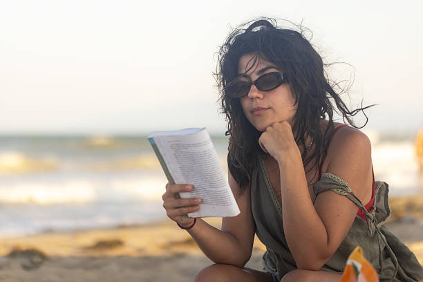 istock Female Reading and Enjoying the Sunset 2225442901