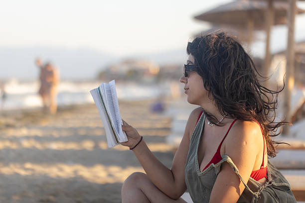 istock Female Reading and Enjoying the Sunset 2225442913