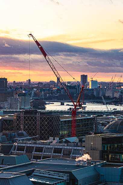 istock Red crane dominating london skyline during a vibrant sunset 2225446966
