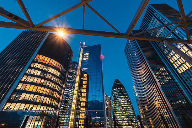 istock Modern skyscrapers lighting up london's financial district at dusk 2225447028