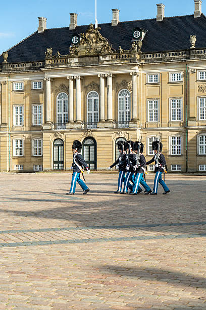 Copenhagen, Denmark -  June 2 2025: Blue sky over Amalienborg Palace and the royal guard