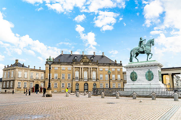Copenhagen, Denmark -  June 2 2025: Visitors admire Amalienborg Palace and guards in Copenhagen