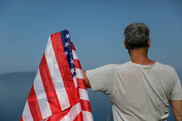 istock Senior Man With USA Flag Celebrating Freedom 2225449548